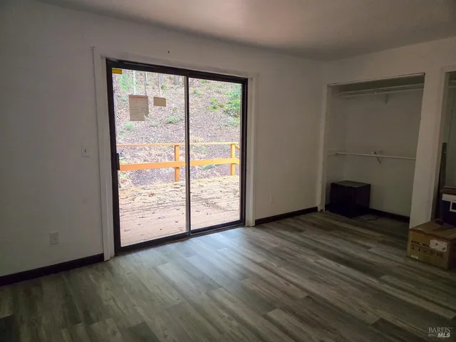 a bathroom with a toilet a sink and a window