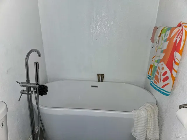 a view of a bathroom with a glass door