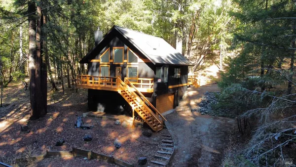a backyard of a house with barbeque oven