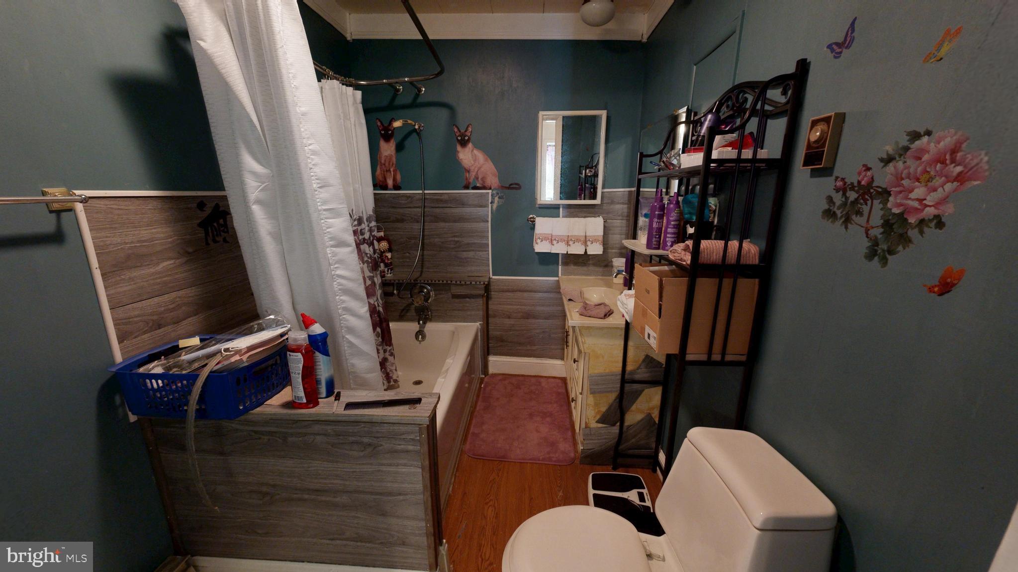 5403 Willow Grove Road Camden Wyoming, DE 19934 - Photo 13 of 42 a view of walk in closet with clothes and shoes