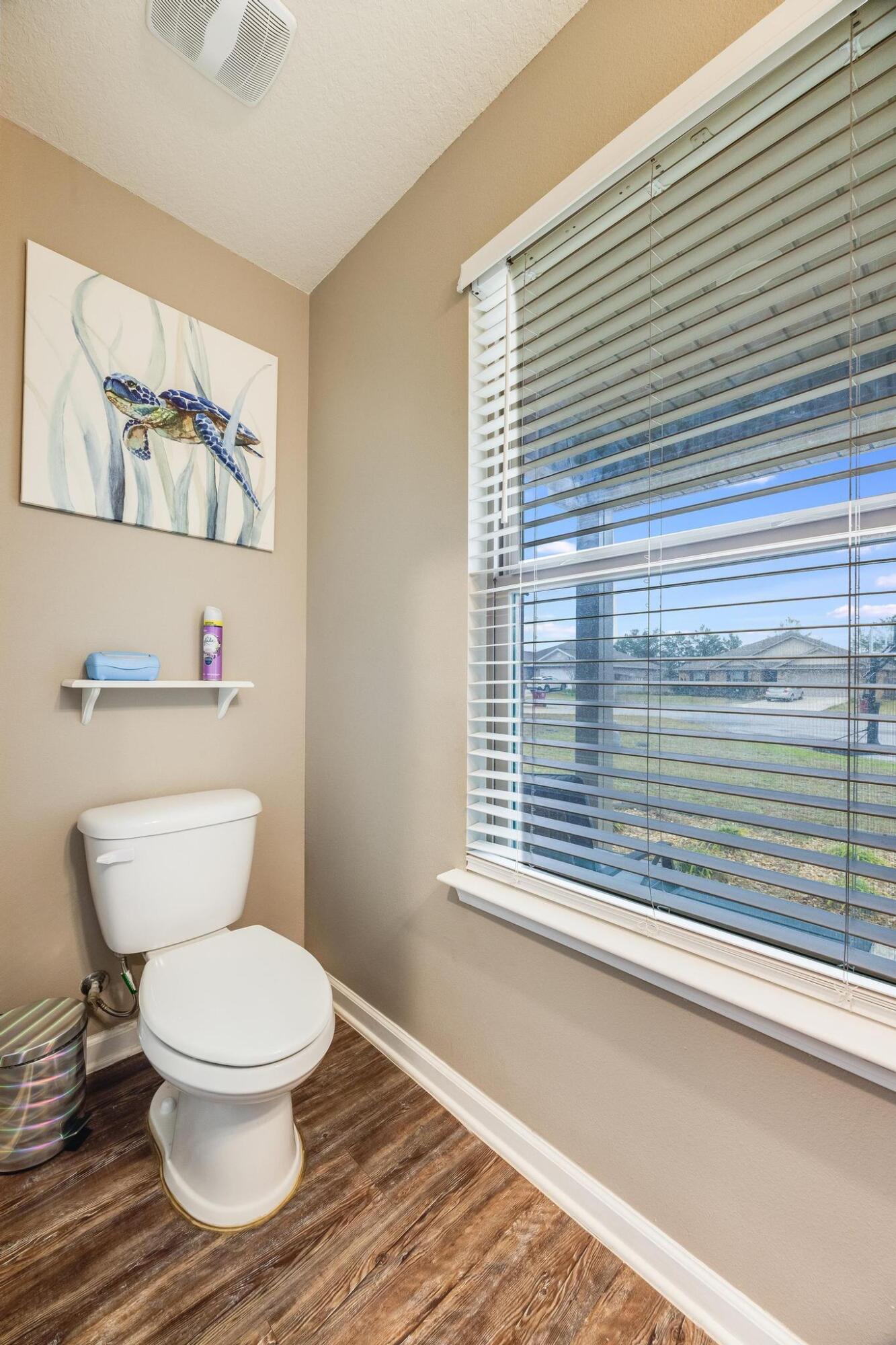 367 Merlin Court Crestview, FL 32539 - Photo 18 of 46 a white toilet sitting next to a window