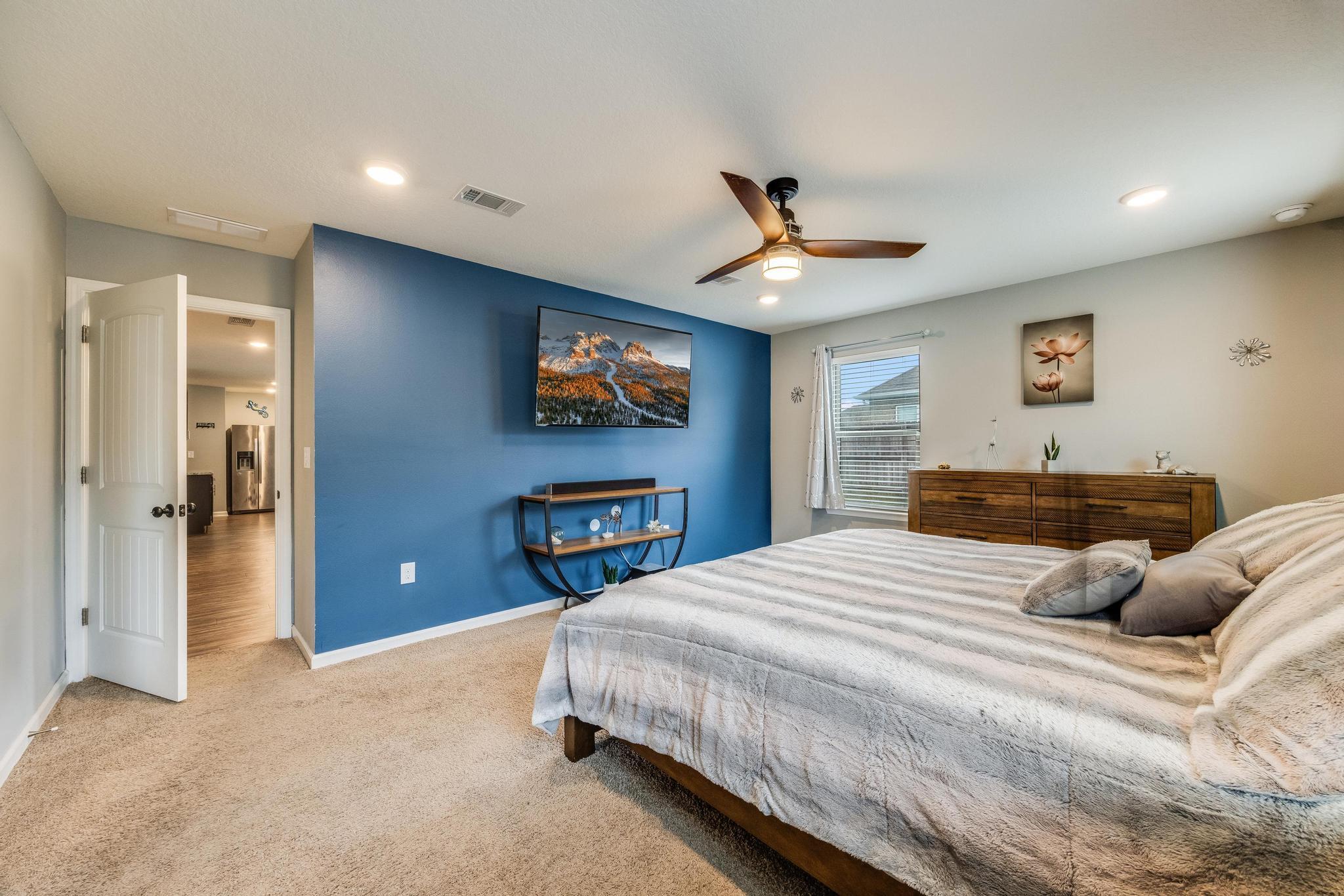 367 Merlin Court Crestview, FL 32539 - Photo 21 of 46 a bedroom with a bed and a ceiling fan