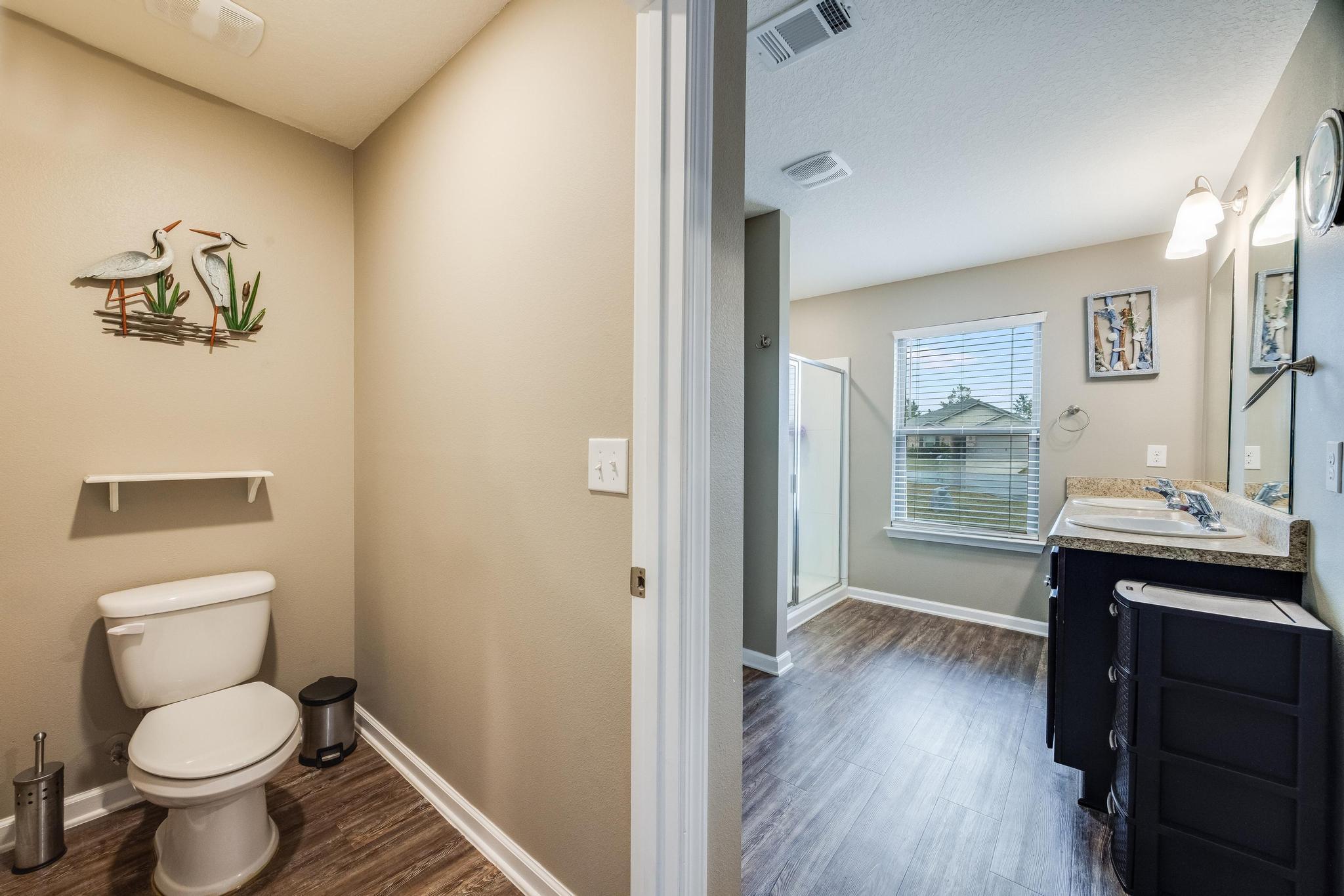 367 Merlin Court Crestview, FL 32539 - Photo 26 of 46 a bathroom with a toilet sink and mirror