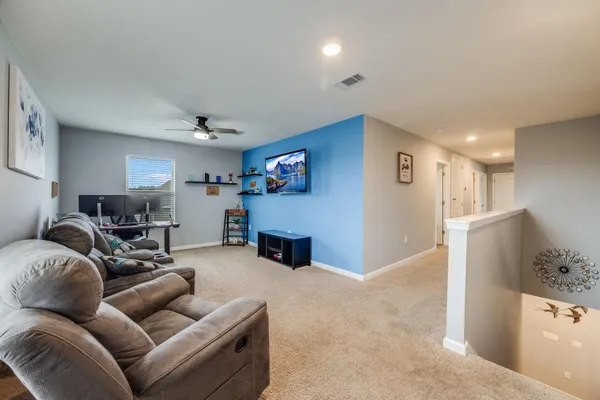 a living room with furniture and a couch