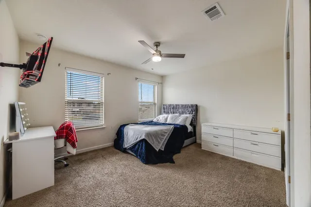 a bed room with a bed and a window