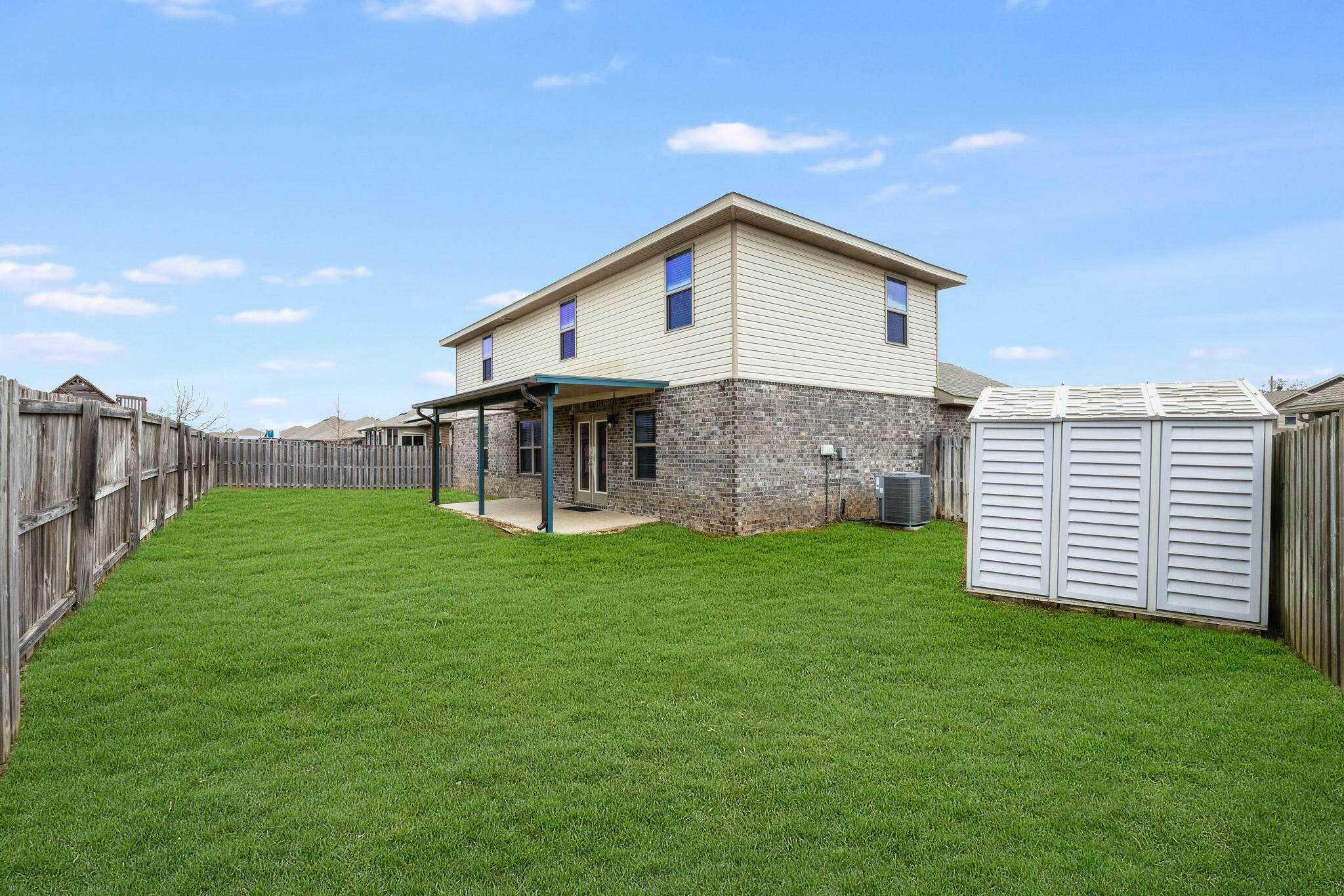 367 Merlin Court Crestview, FL 32539 - Photo 37 of 46 a view of a backyard with plants and large trees