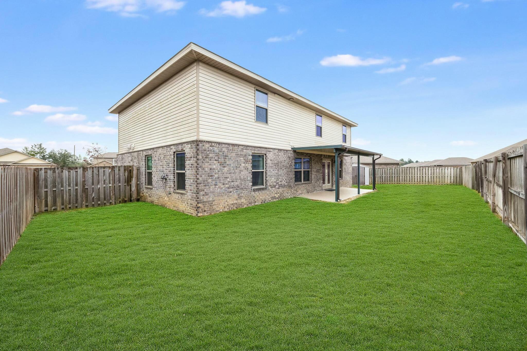 367 Merlin Court Crestview, FL 32539 - Photo 38 of 46 a view of a house with backyard and garden