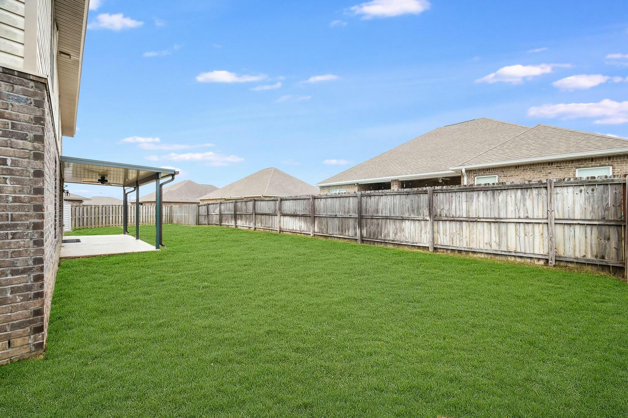 367 Merlin Court Crestview, FL 32539 - Photo 40 of 46 a view of a backyard with a garden and plants