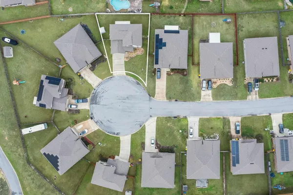 an aerial view of houses with outdoor space