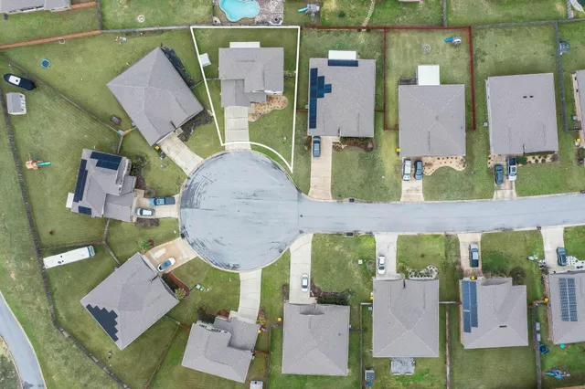 an aerial view of houses with outdoor space