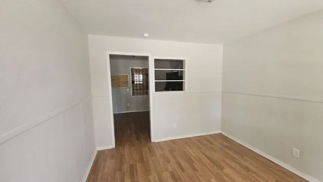 a view of wooden floor in an empty room