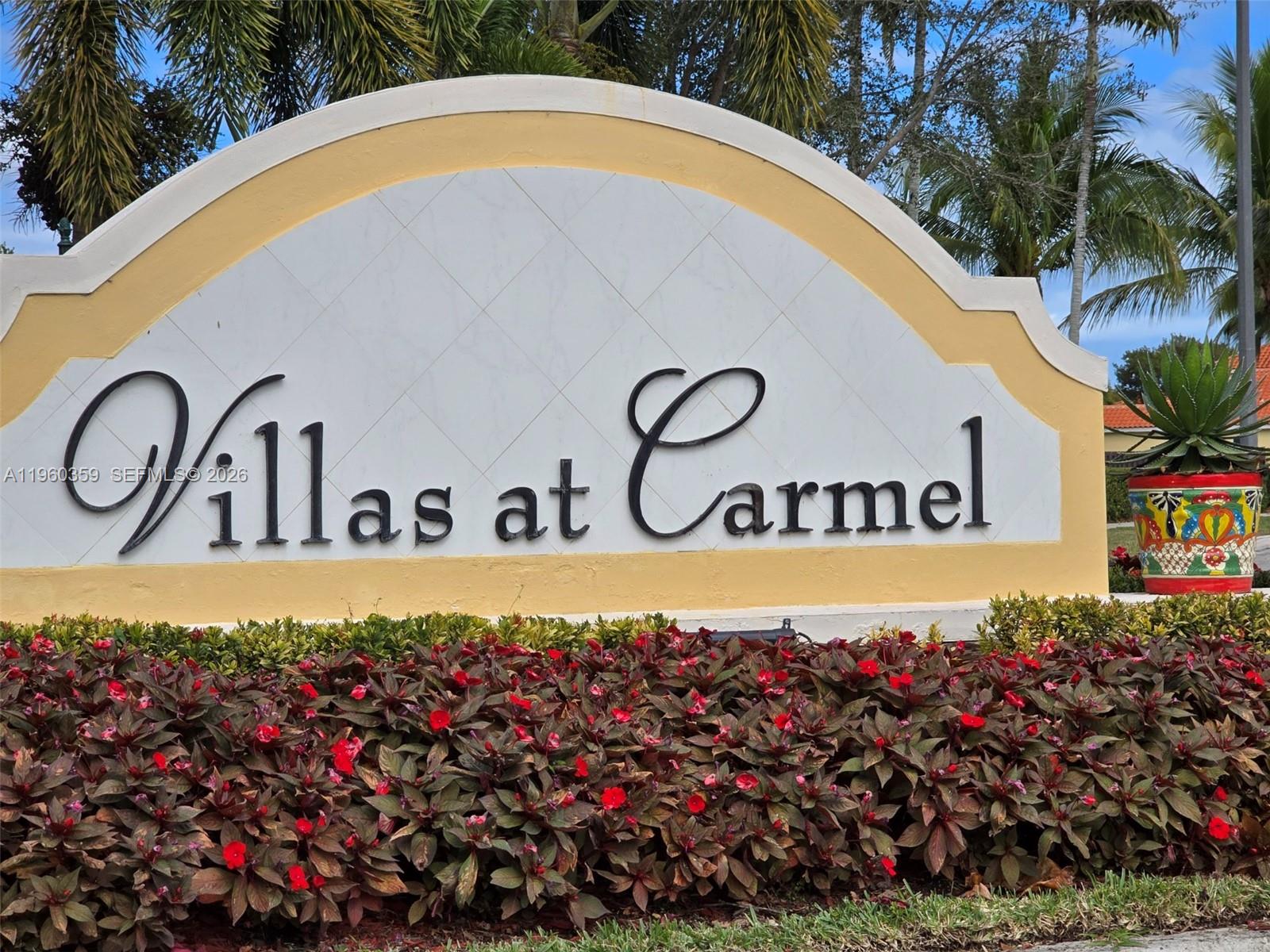 1575 Northeast 33rd Avenue, Unit 1049 Homestead, FL 33033 - Photo 1 of 22 a view of sign board with flower around