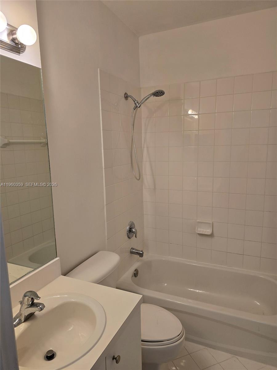 1575 Northeast 33rd Avenue, Unit 1049 Homestead, FL 33033 - Photo 17 of 22 a bathroom with a sink toilet and shower