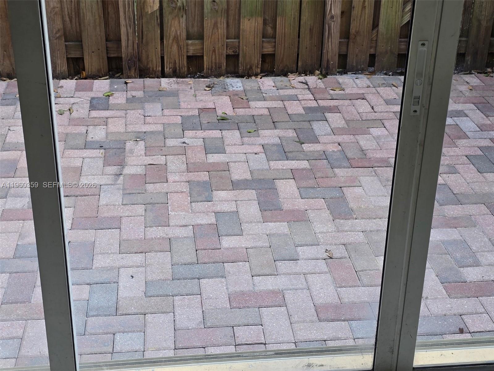 1575 Northeast 33rd Avenue, Unit 1049 Homestead, FL 33033 - Photo 10 of 22 a brick building with a wooden door