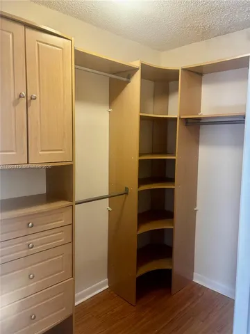 a view of an empty walk in closet