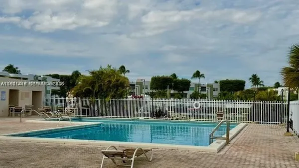 a view of a fountain and a big yard