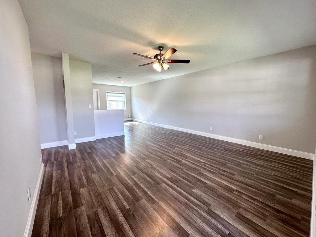 848 Center Street, Unit 3 Jupiter, FL 33458 - Photo 8 of 9 wooden floor in an empty room with a window