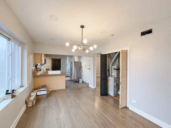a view of hallway with wooden floor