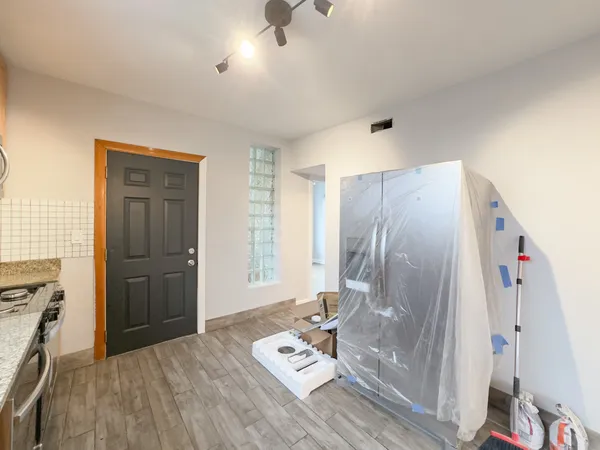 a view of an empty room with a window