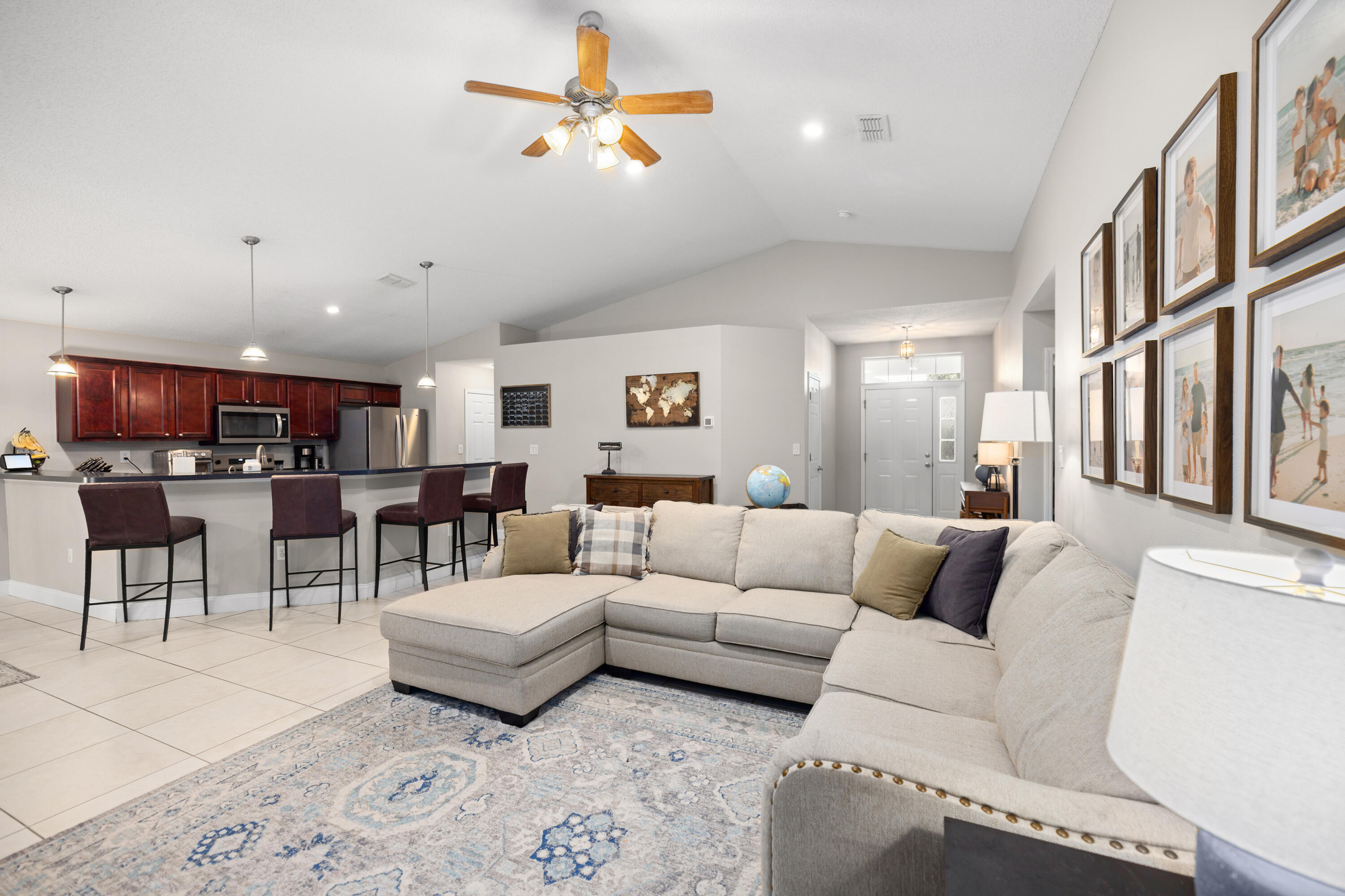 202 Limestone Circle Crestview, FL 32539 - Photo 10 of 49 a living room with furniture kitchen view and a chandelier