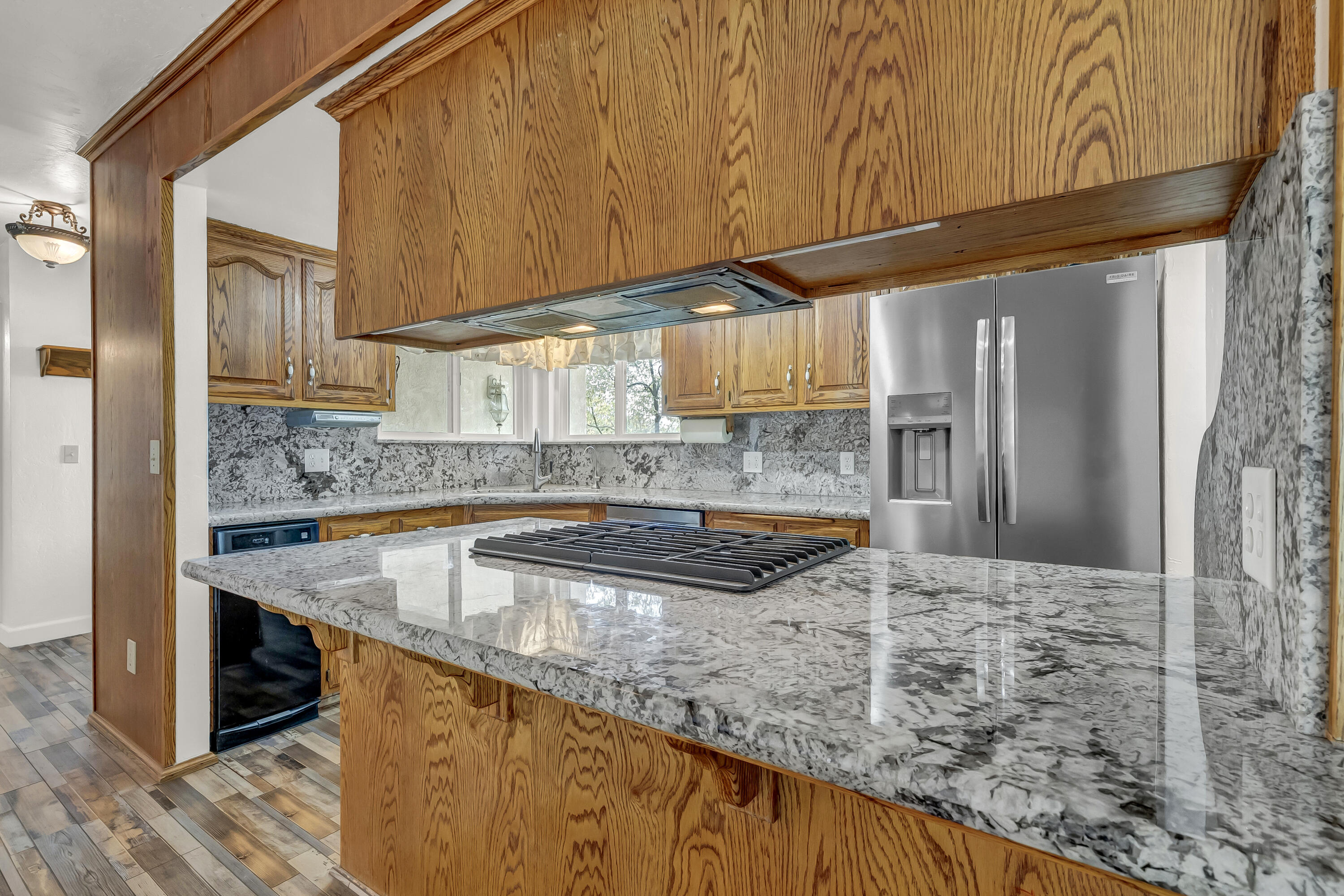 18002 320th Road Springville, CA 93265 - Photo 26 of 56 a kitchen with stainless steel appliances granite countertop a sink and a counter space