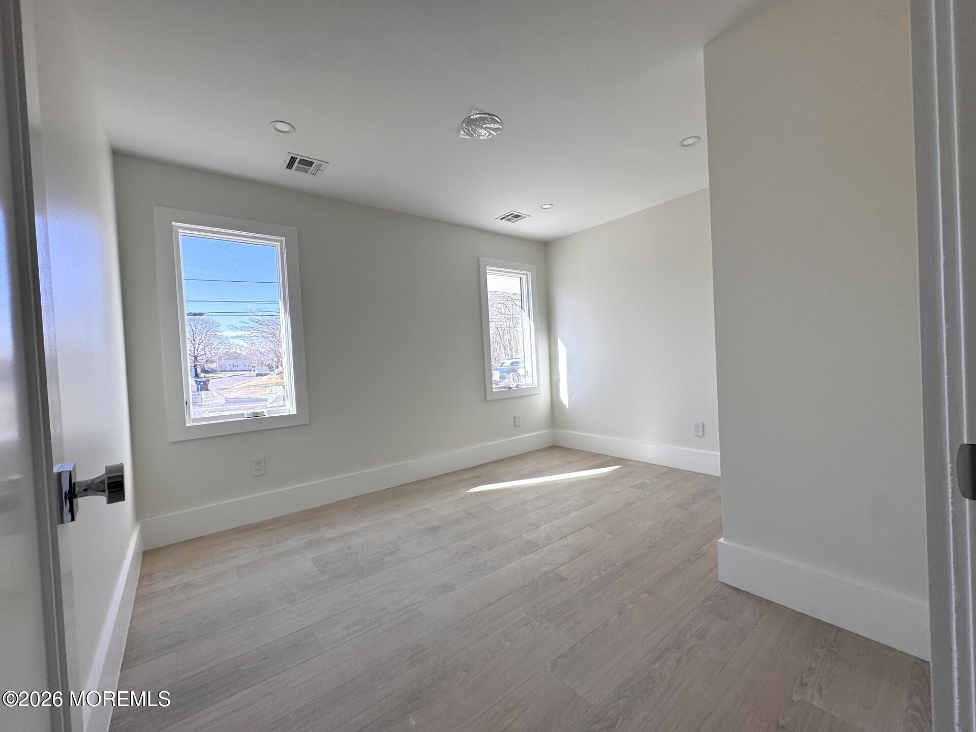 7 Whalepond Road Oakhurst, NJ 07755 - Photo 9 of 10 a view of an empty room with a window