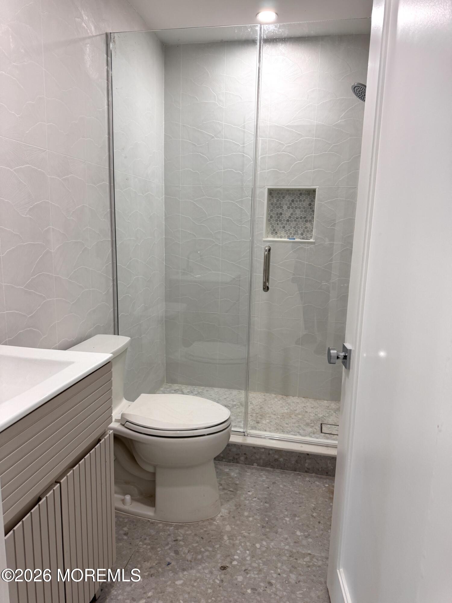 7 Whalepond Road Oakhurst, NJ 07755 - Photo 10 of 10 a bathroom with a toilet and a shower