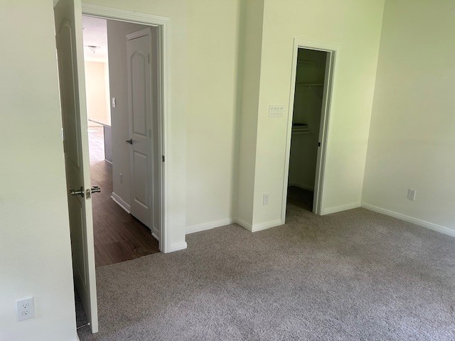 15010 Austin Road Willis, TX 77378 - Photo 14 of 22 a view of a hallway with closet and wooden floor