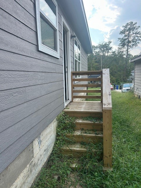 15010 Austin Road Willis, TX 77378 - Photo 19 of 22 a view of a pathway of a house with a yard