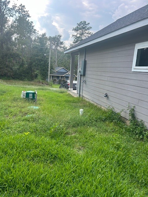 15010 Austin Road Willis, TX 77378 - Photo 21 of 22 a view of a chair and table in backyard of the house