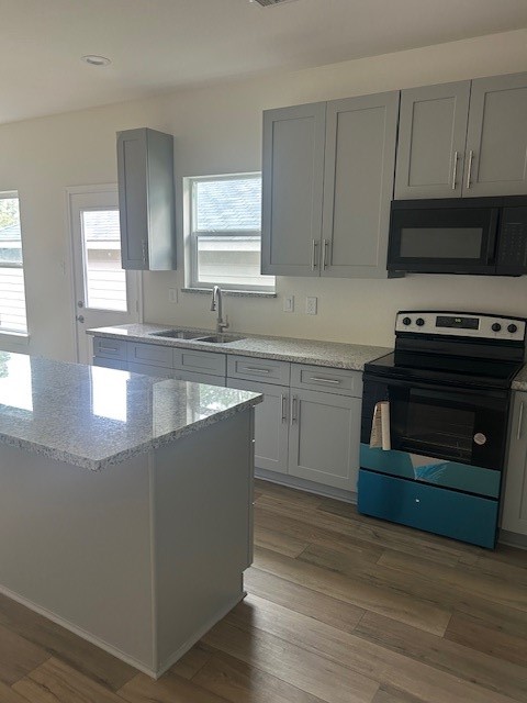 15010 Austin Road Willis, TX 77378 - Photo 5 of 22 a kitchen with wooden cabinets and a stove top oven