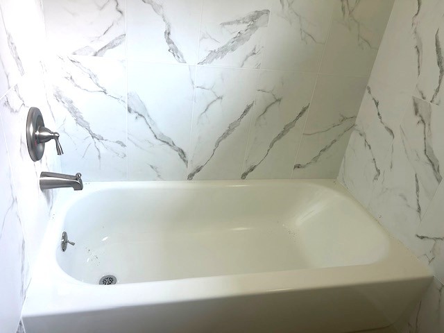 15010 Austin Road Willis, TX 77378 - Photo 10 of 22 a bathroom with a bathtub