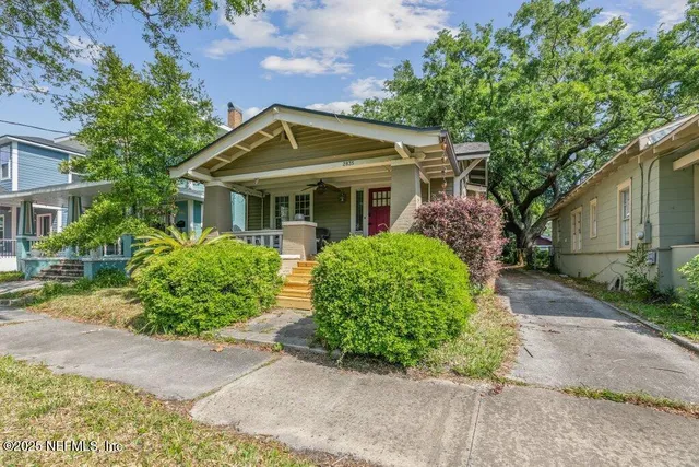 front view of a house with a garden