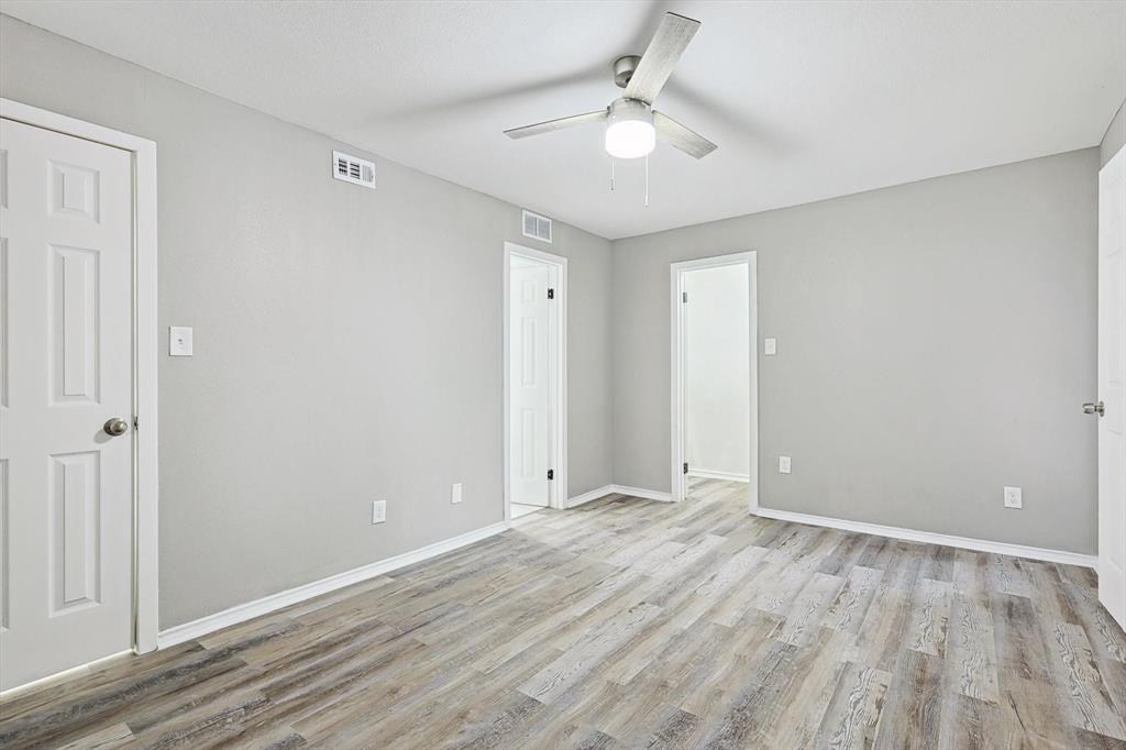 9805 Walnut Street, Unit 201 Dallas, TX 75243 - Photo 15 of 26 Spare room featuring light hardwood / wood-style floors and ceiling fan