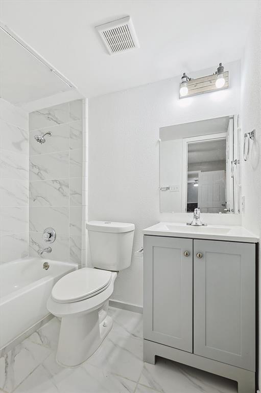 9805 Walnut Street, Unit 201 Dallas, TX 75243 - Photo 16 of 26 Full bathroom featuring tiled shower / bath, vanity, toilet, and tile floors