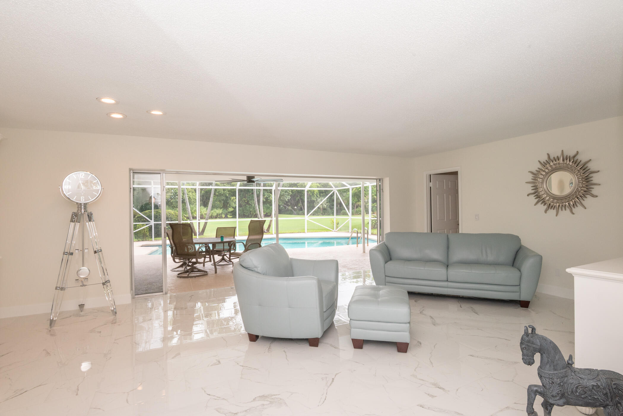 2811 Southeast Fairway West Stuart, FL 34997 - Photo 12 of 40 a living room with furniture and a large window