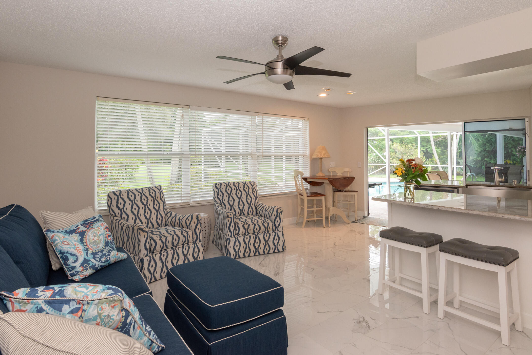 2811 Southeast Fairway West Stuart, FL 34997 - Photo 20 of 40 a living room with furniture and a large window