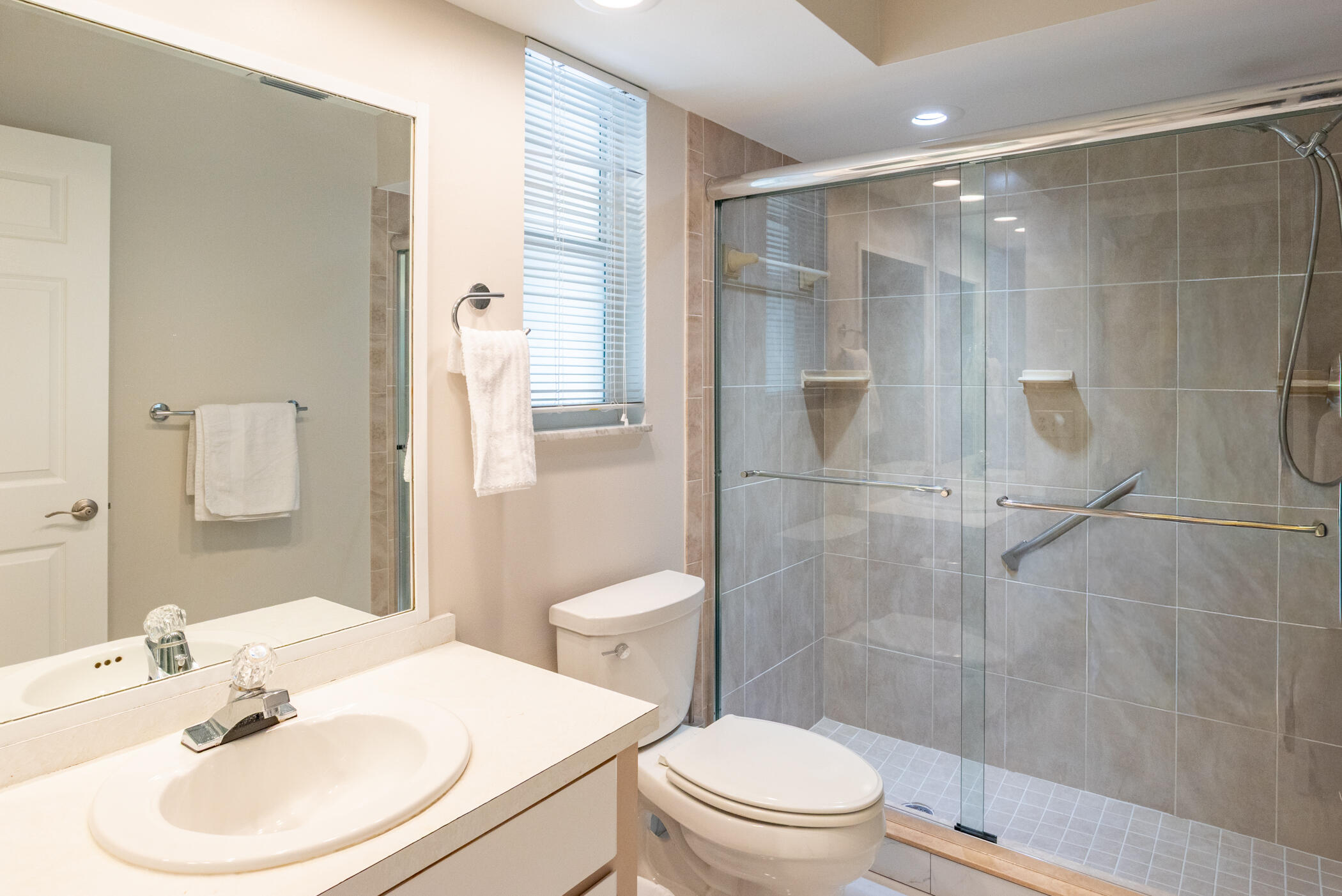 2811 Southeast Fairway West Stuart, FL 34997 - Photo 26 of 40 a bathroom with a sink toilet and shower