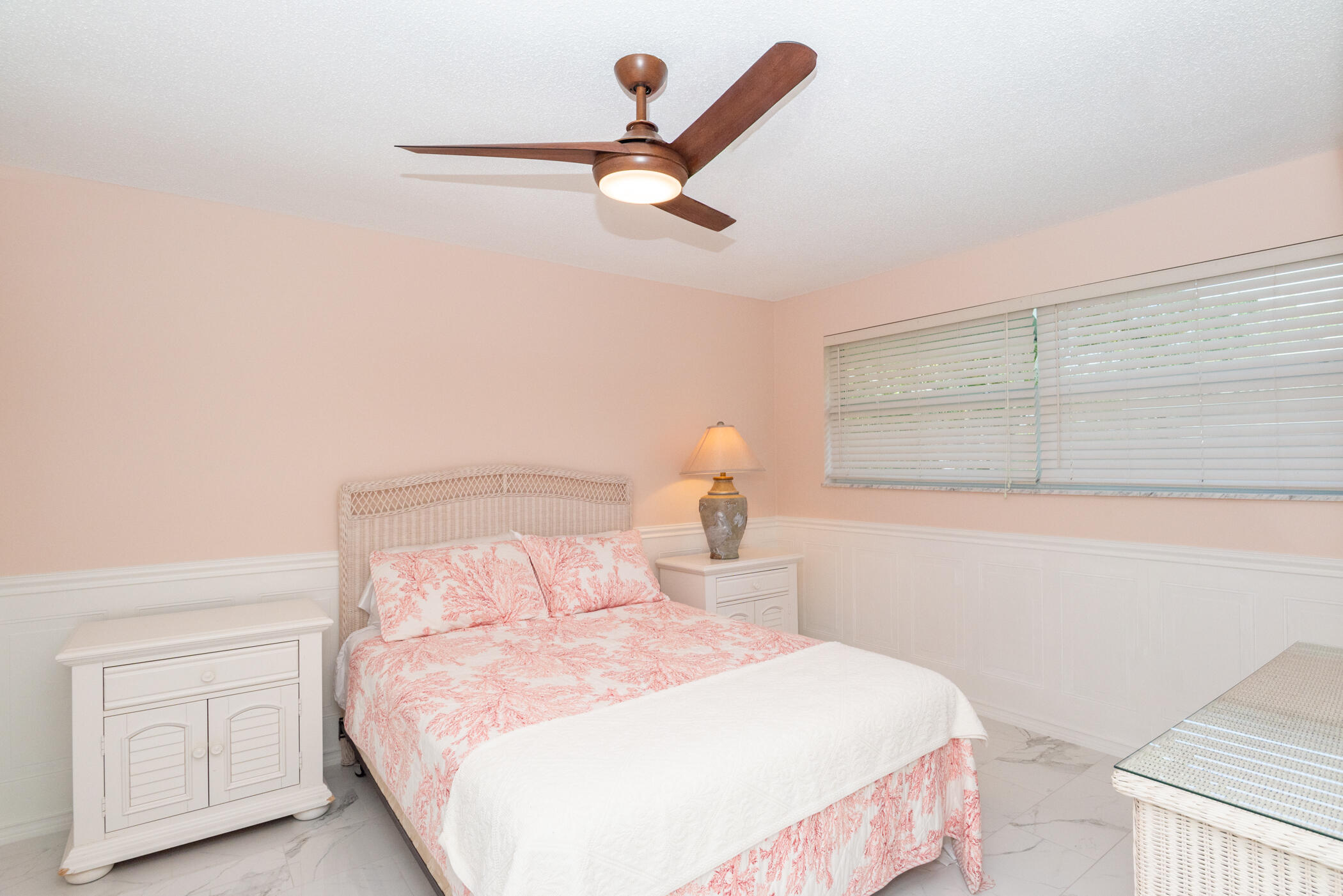 2811 Southeast Fairway West Stuart, FL 34997 - Photo 27 of 40 a bedroom with a bed and a window