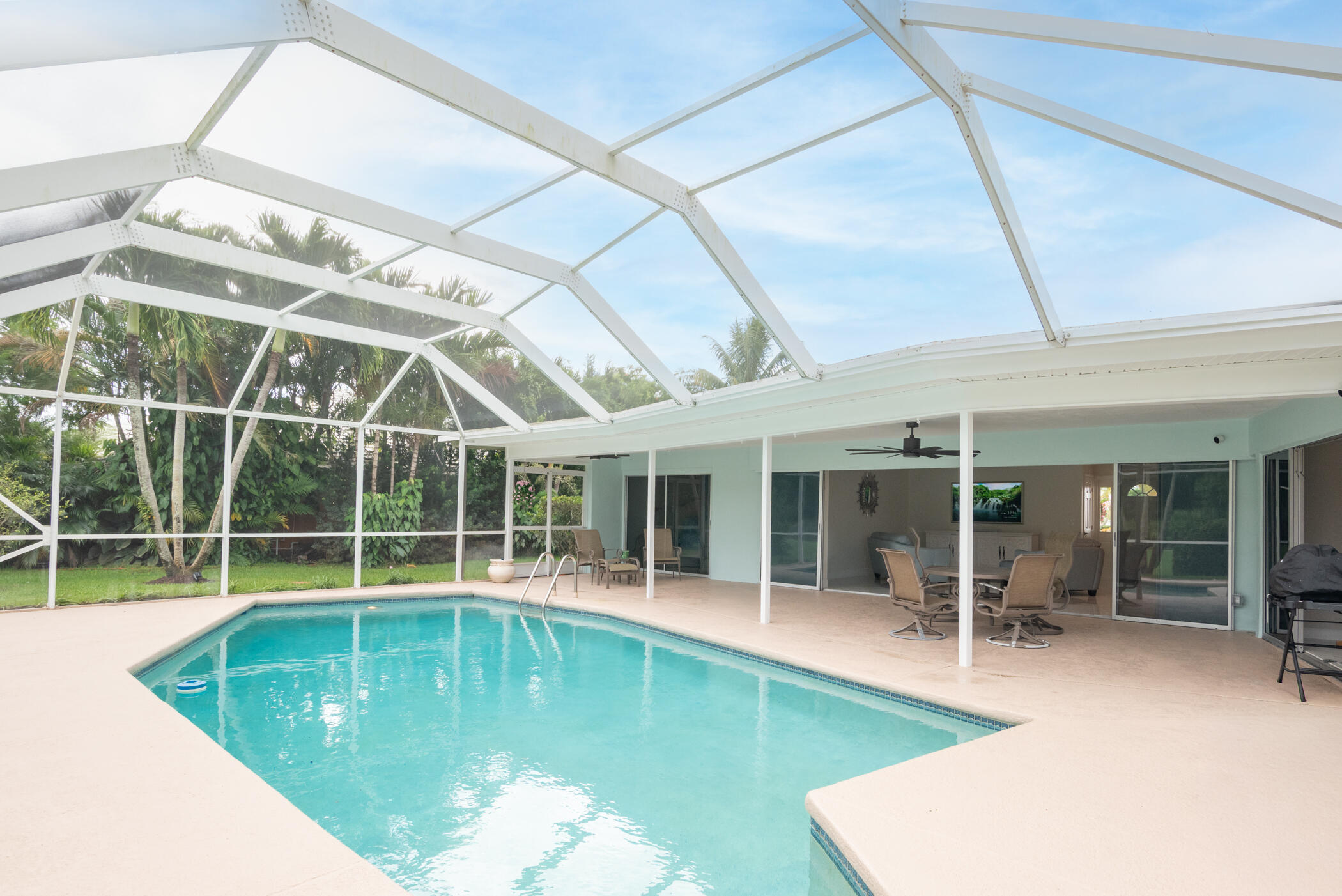 2811 Southeast Fairway West Stuart, FL 34997 - Photo 33 of 40 a view of a swimming pool with a patio