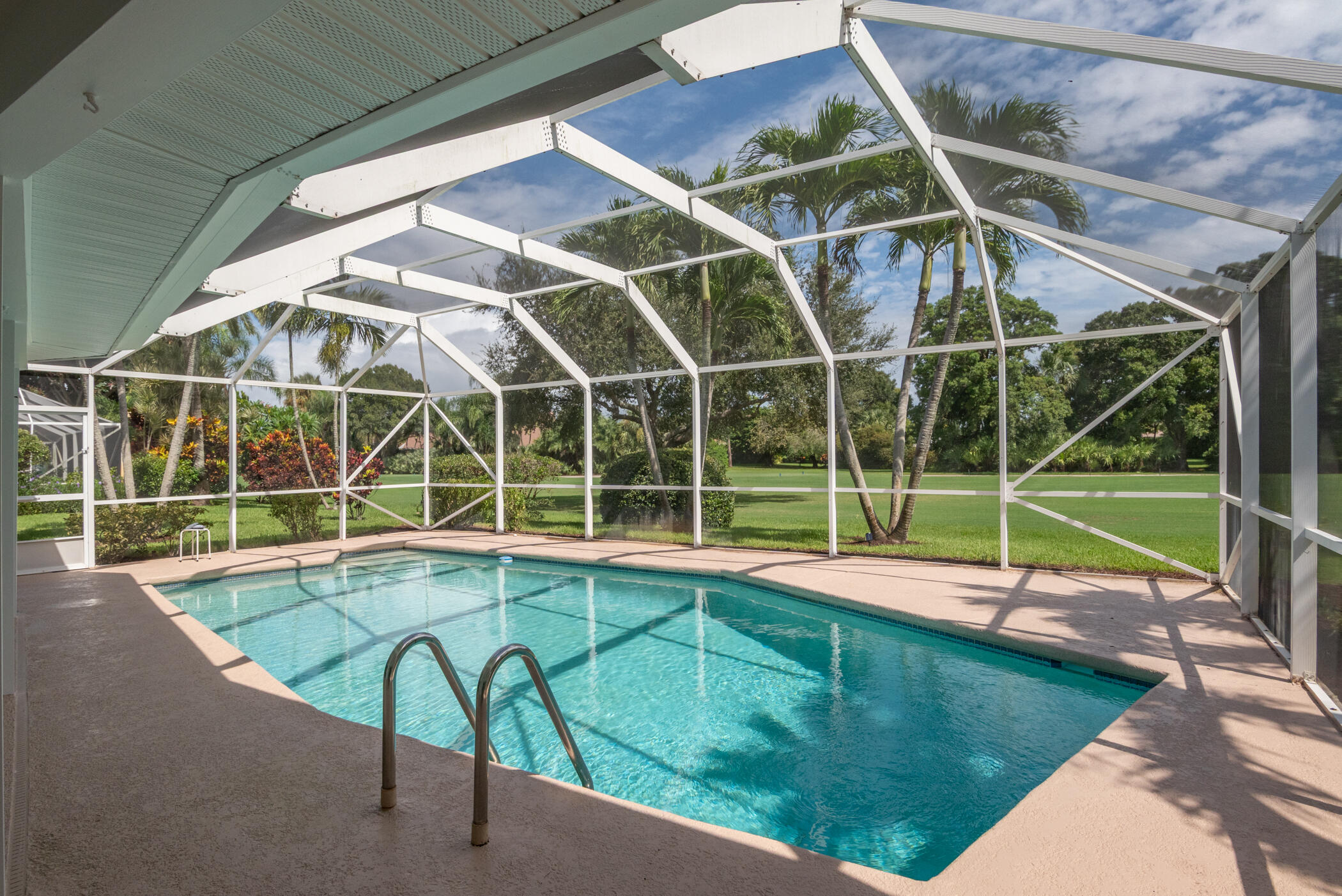 2811 Southeast Fairway West Stuart, FL 34997 - Photo 34 of 40 a view of a backyard with a swimming pool