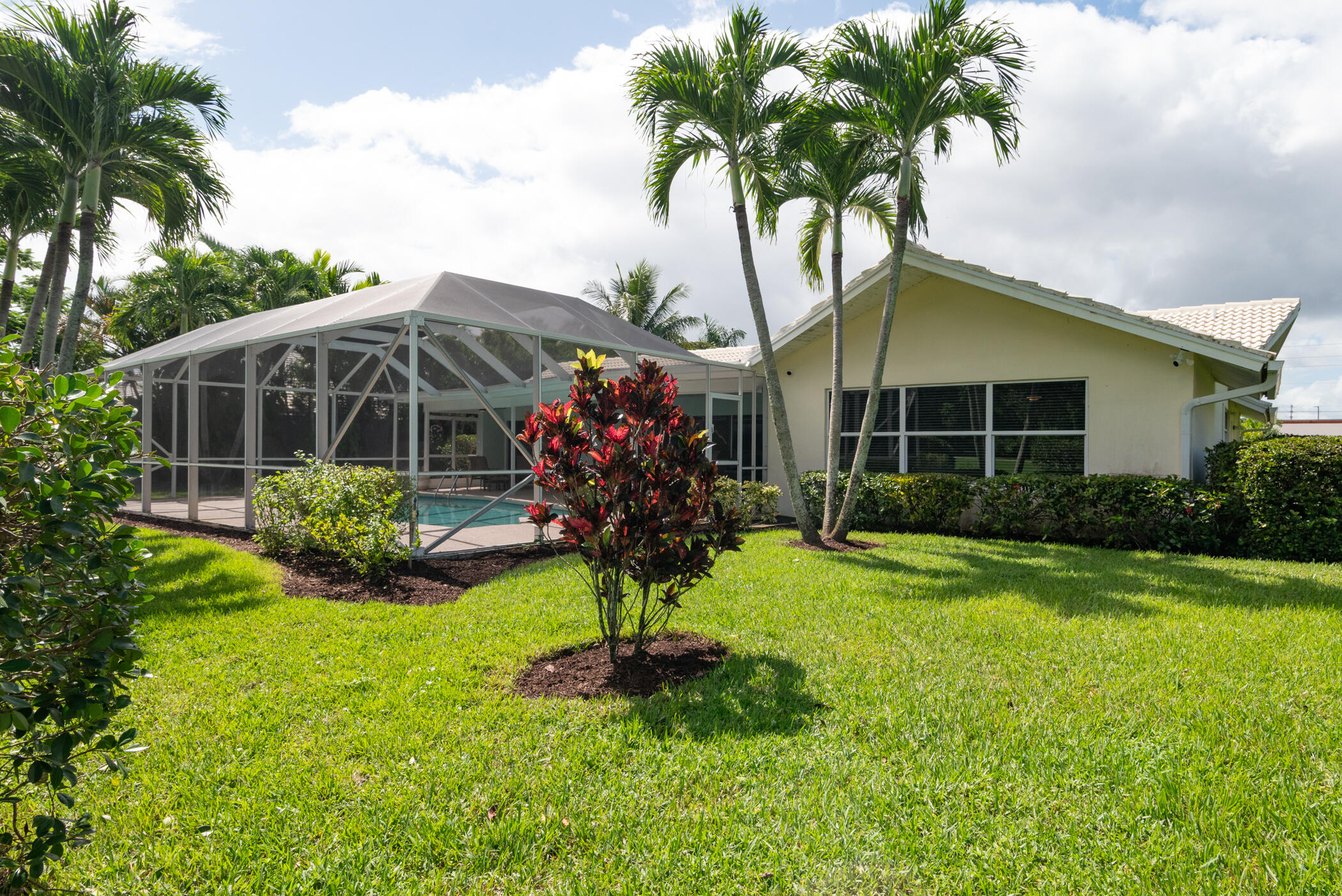 2811 Southeast Fairway West Stuart, FL 34997 - Photo 6 of 40 a view of a house with a yard and potted plants