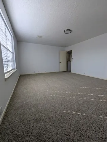 a view of a bathroom with a sink and mirror