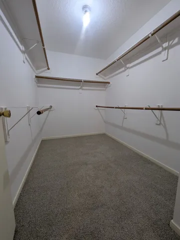 a view of a big yard with an outdoor space and seating