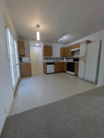 a white toilet sitting in a bathroom