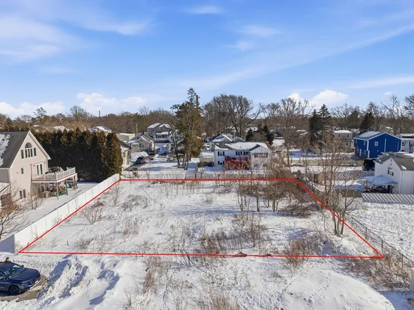 a view of a backyard with sitting area