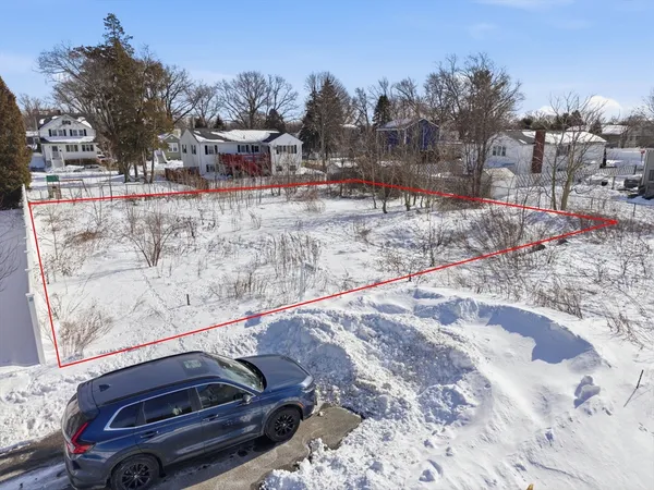 an aerial view of a city with lots of residential buildings