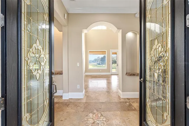 a en suite bathroom with a granite countertop sink and a mirror