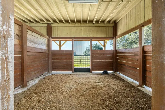a kitchen with stainless steel appliances granite countertop a sink and a stove with wooden floor