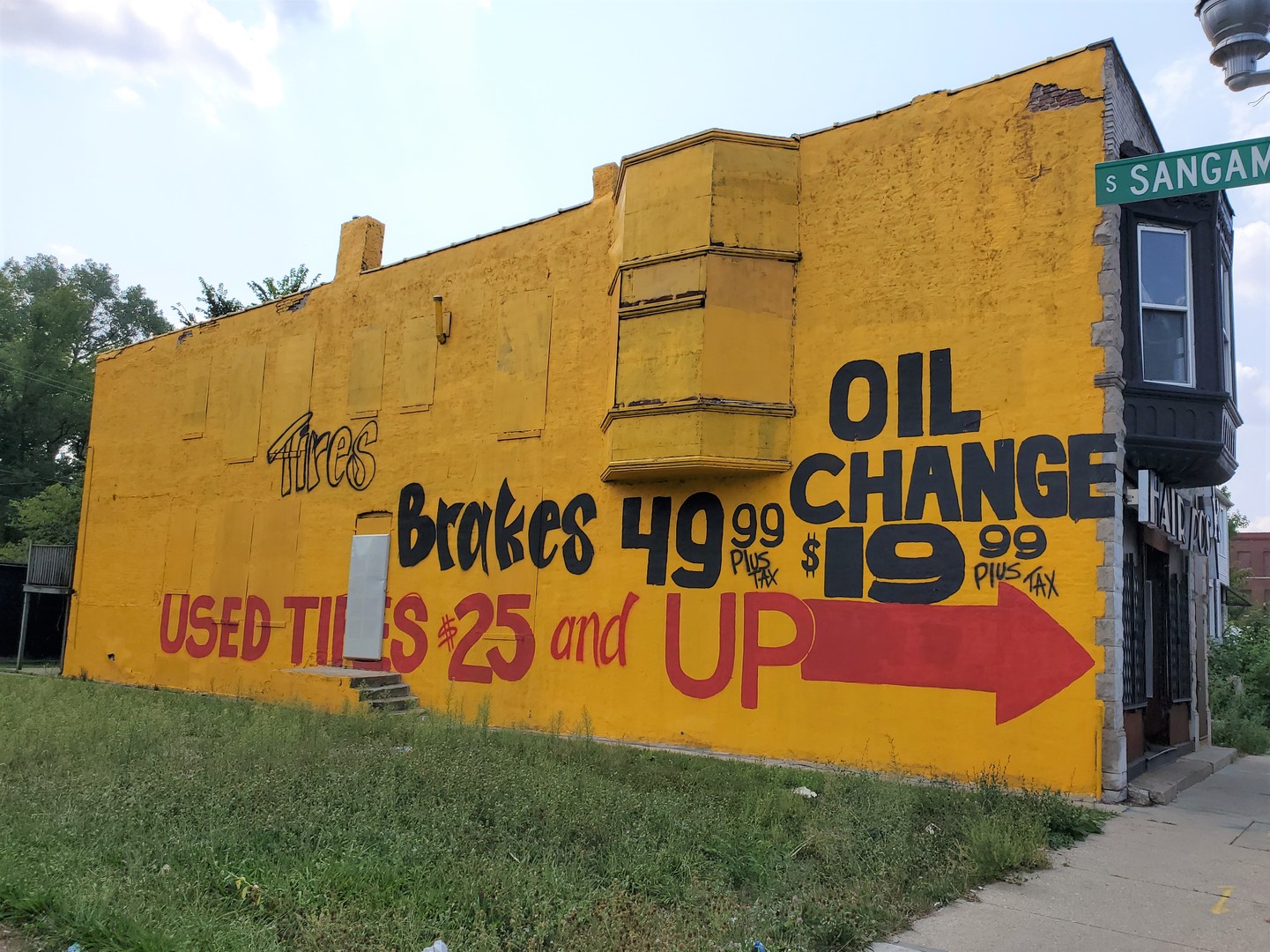 937 West 59th Street Chicago, IL 60621 - Photo 2 of 11 a sign board with building in the background